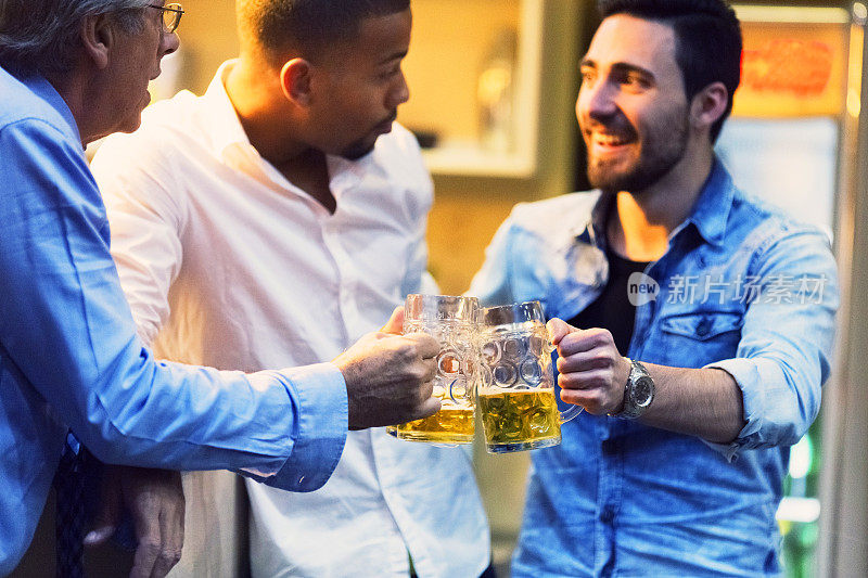 Group of friends, coworkers, drinking beer in the pub